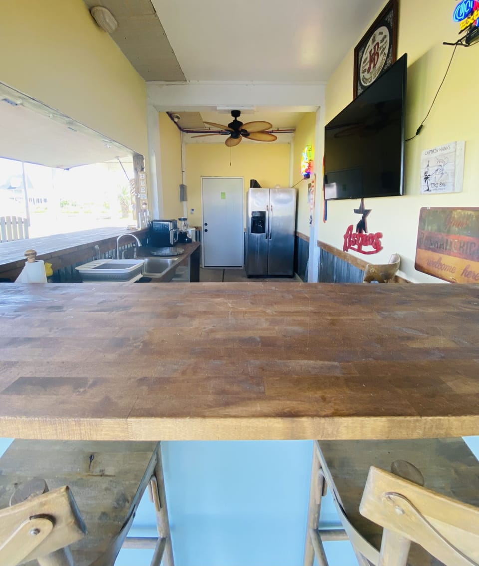 Prep your meal with a full size refrigerator and sink and large charcoal grill