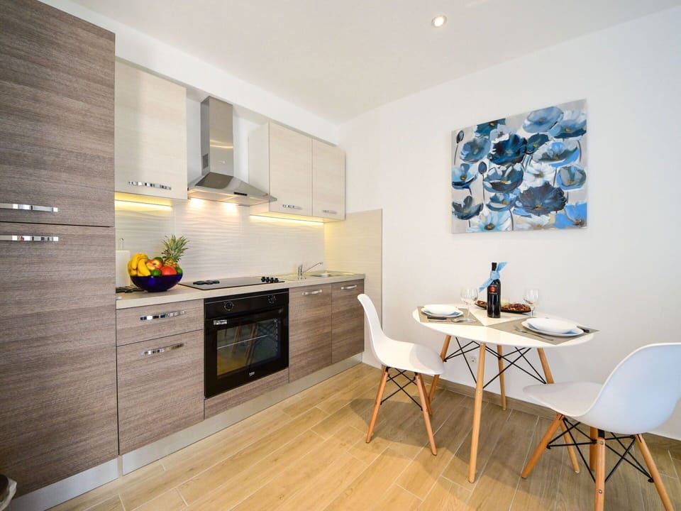 Cabinetry, Furniture, Countertop, Building, Kitchen Stove, Wood, Table, Interior Design, Kitchen, Flooring