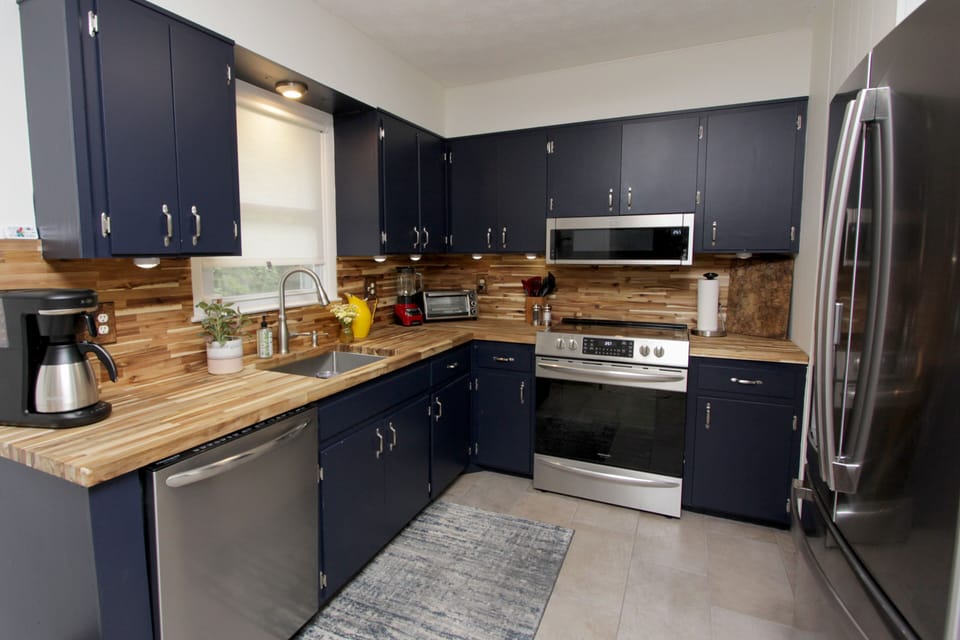 Updated kitchen w/ new appliances fully stocked w/ amenities. 