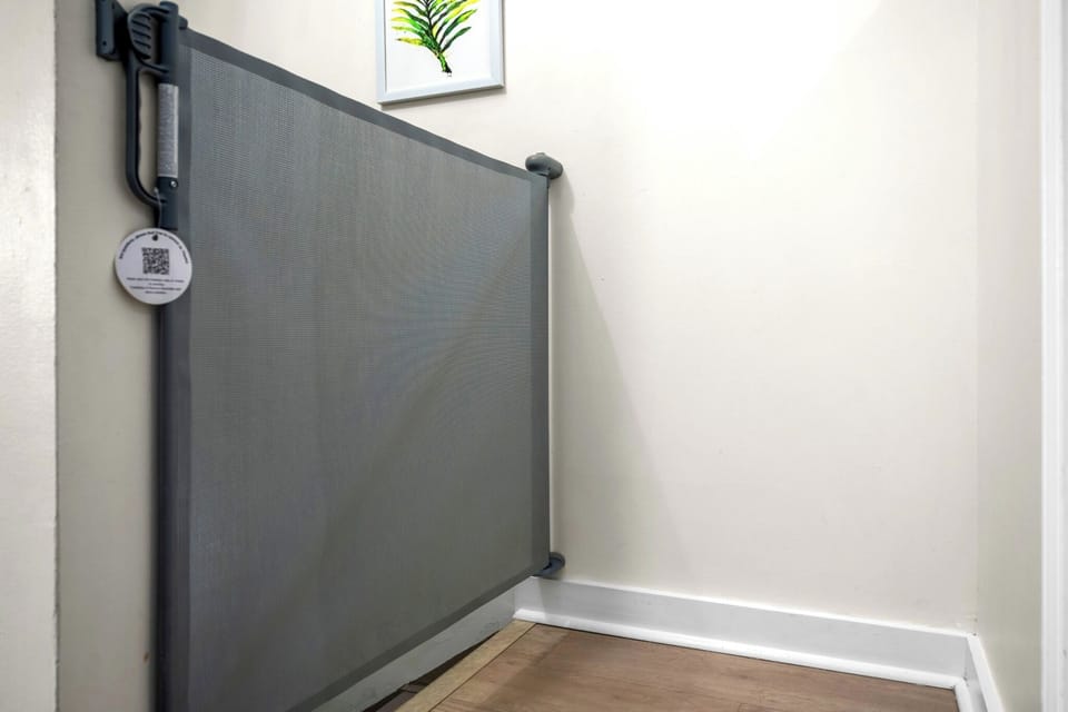 Retractable gates at the top (and bottom) of the stairs for added safety
