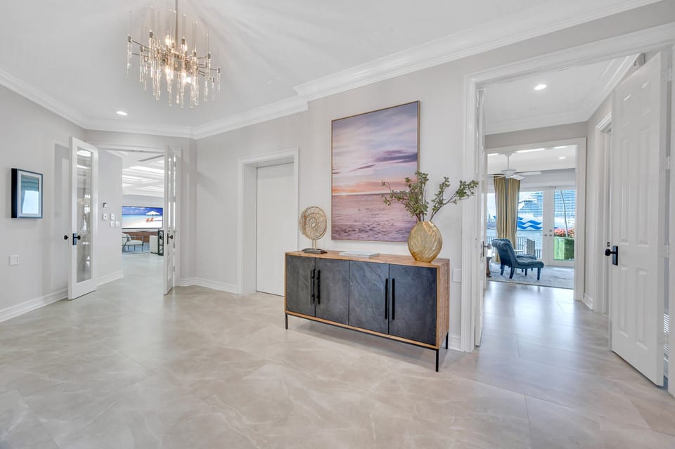 Spacious main hallway with its access to the elevator lading to all three floors.