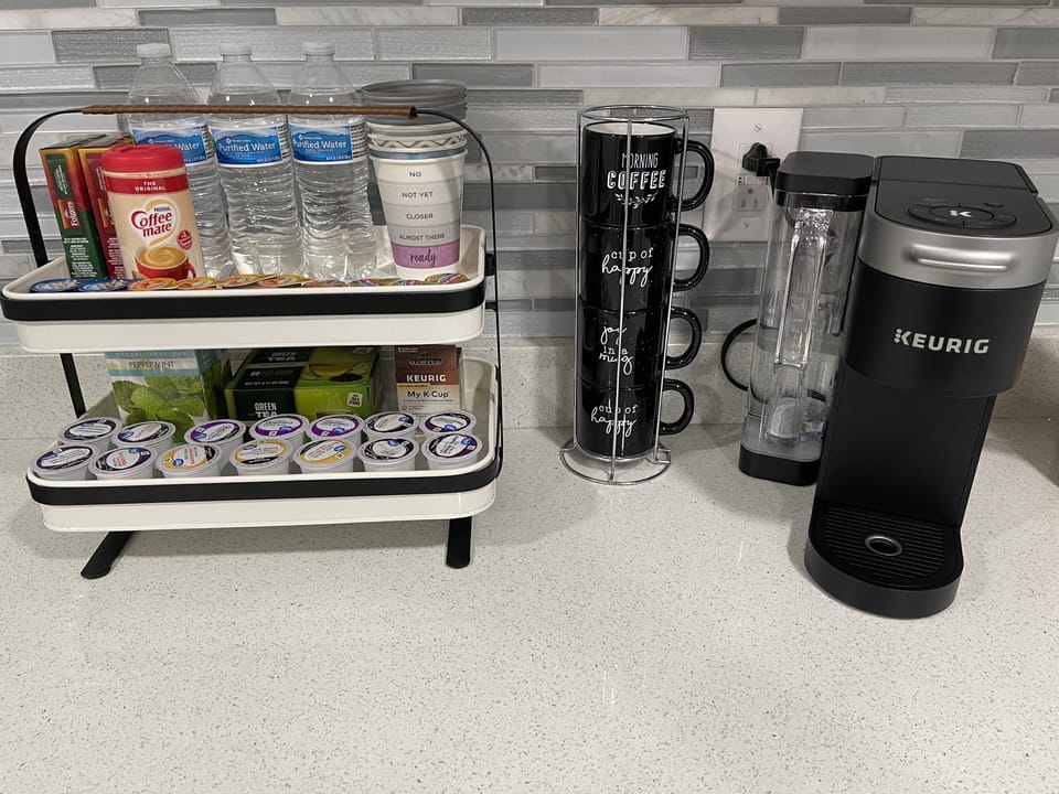 Keurig coffee maker with a variety of options for coffee and creamers. 
