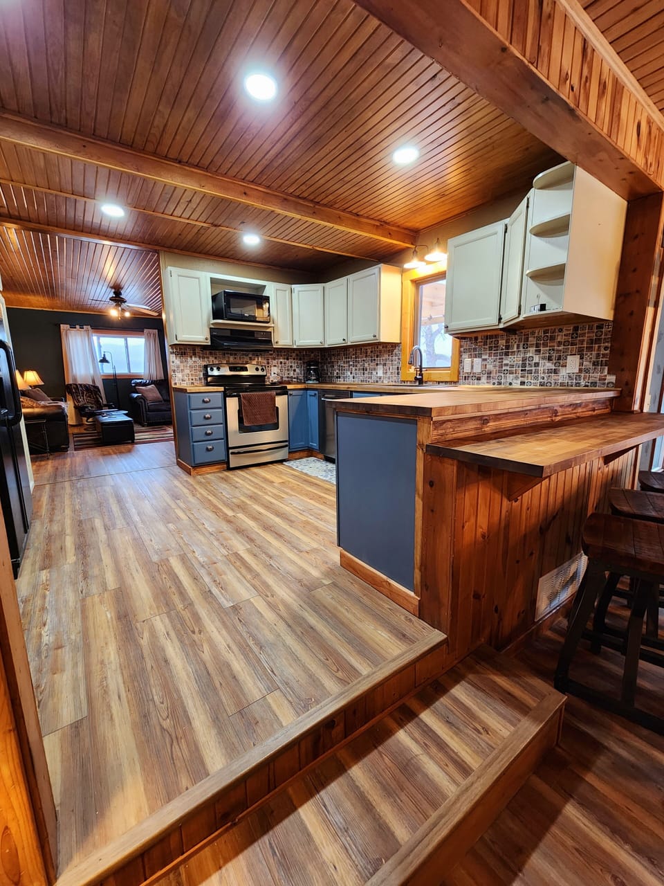 The full kitchen is easily accessed from the TV room and the great room.