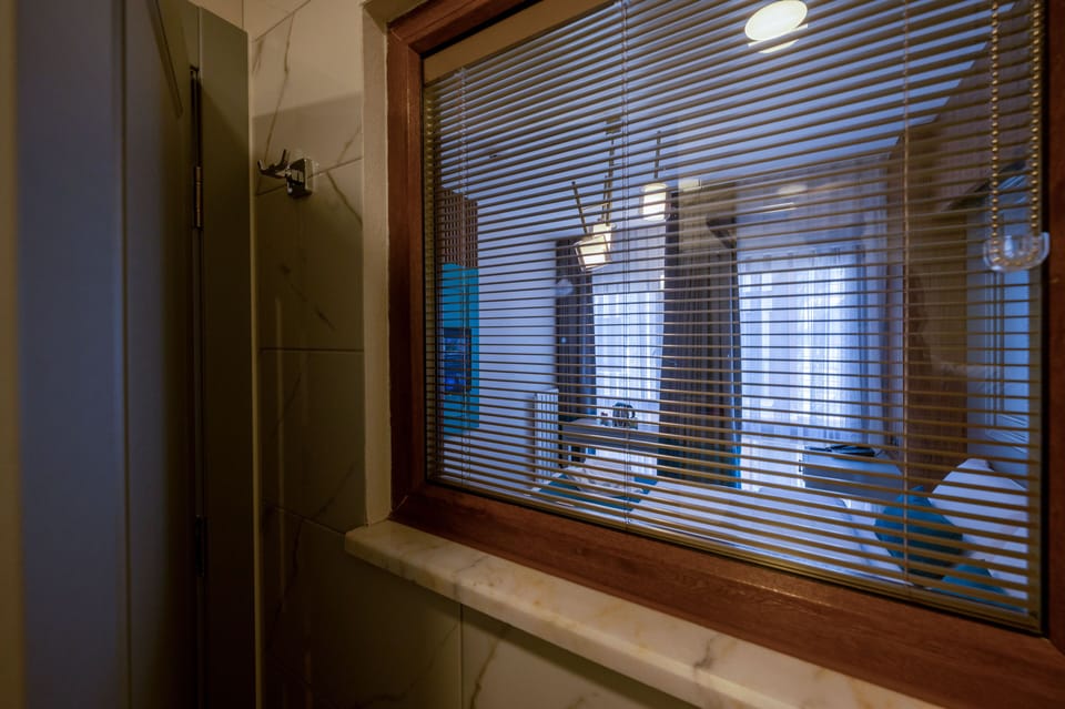 Shower, hair dryer, slippers, towels