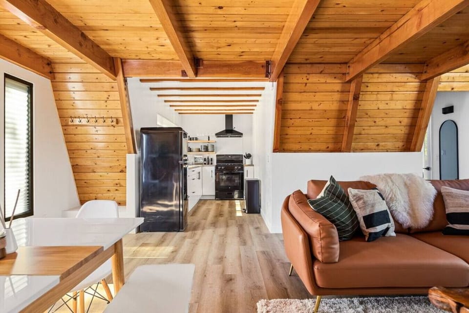 The living room space opens up into the kitchen and the dining space.