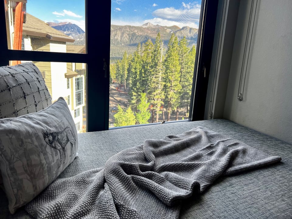 Snuggle up and read in this cozy nook with fantastic views.