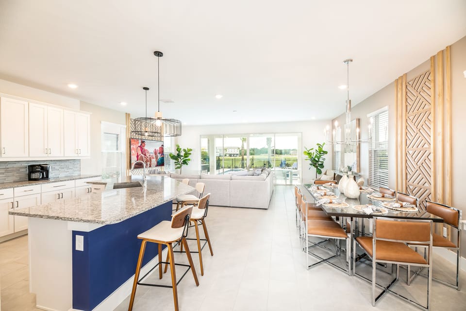 Living area - kitchen island, dining room table, couch