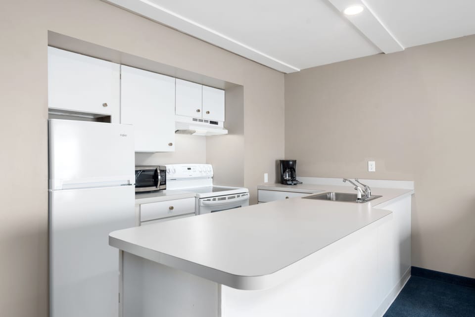 King Suite with Kitchen and Sofa Bed, Balcony | Private kitchen | Fridge, microwave, coffee/tea maker