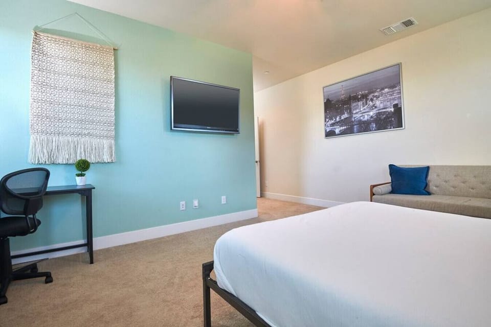 Master Bedroom - 1 Queen bed, full bathroom, and 1 couch with 50" TV and Roku.