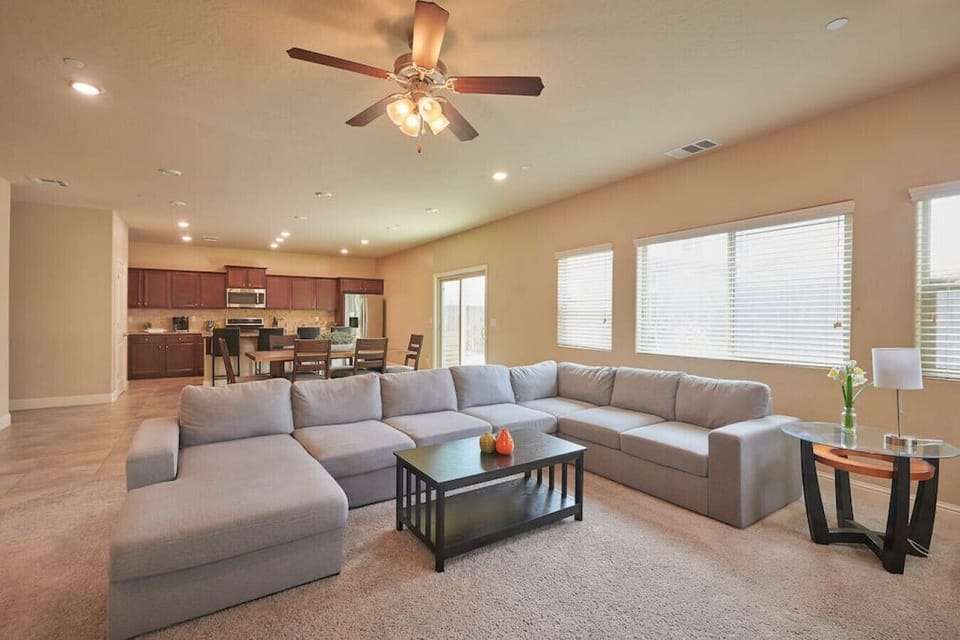 Spacious and cozy living room with 65" 4k TV, and Roku.