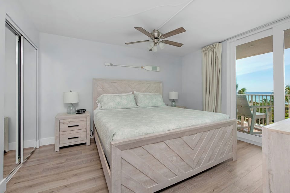 Primary bedroom with balcony access