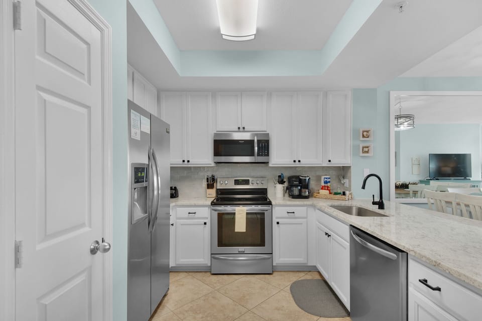 Your fully equipped kitchen features modern stainless appliances and granite countertops for memorable home-cooked meals.