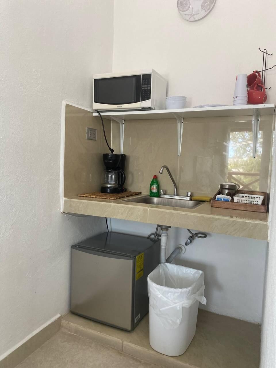 Mini-fridge, microwave, coffee/tea maker, cookware/dishes/utensils