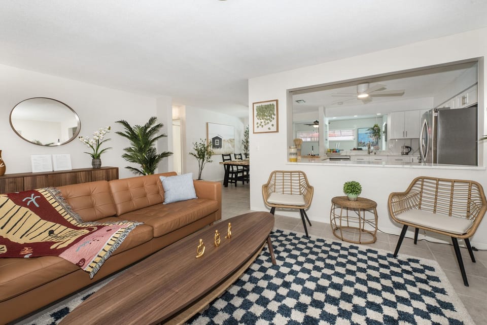Living room's seating area. Pillows and throws are provided.