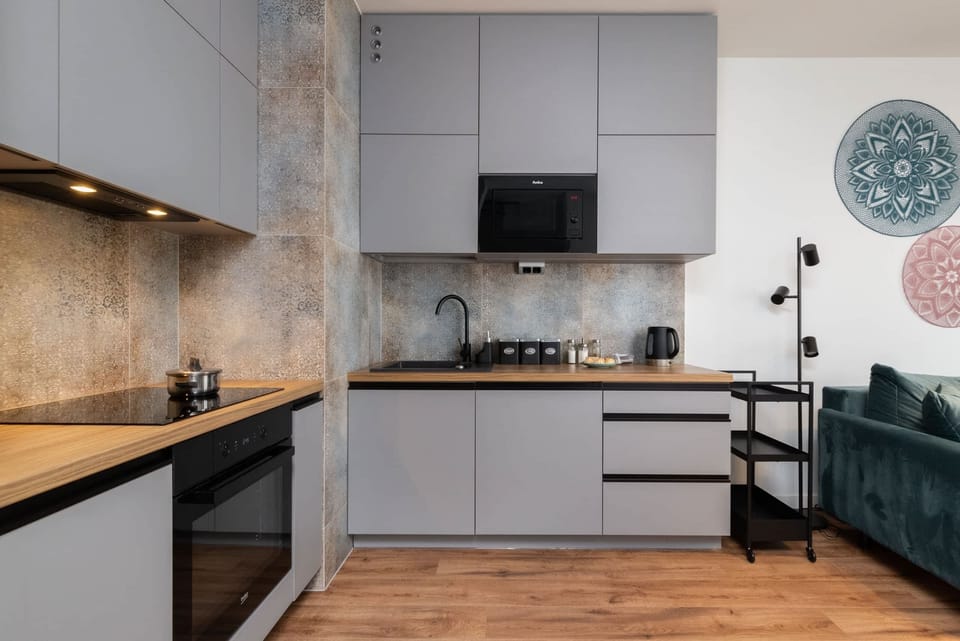 Another angle of the kitchen, featuring modern cabinetry and a spacious layout.