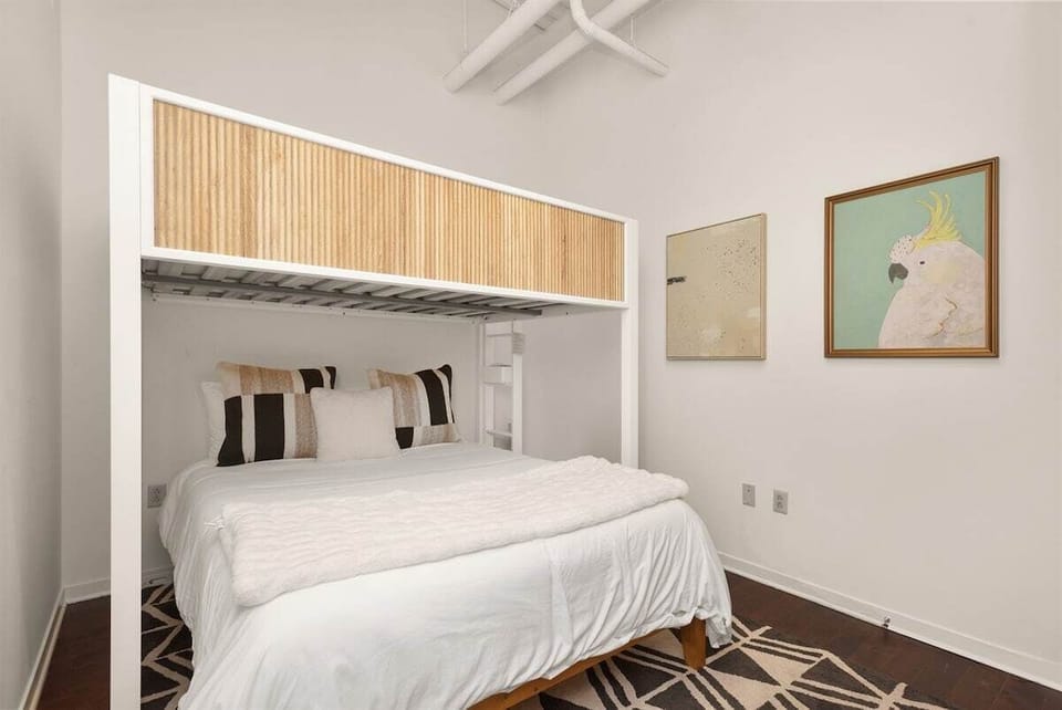 Guest bedroom with queen bed and twin loft