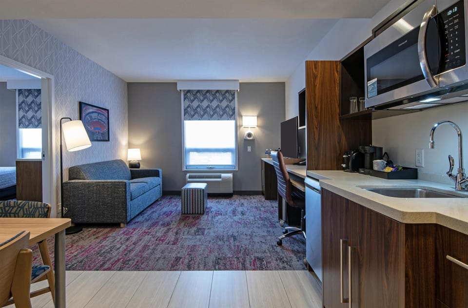 Studio, 2 Queen Beds, Non Smoking | Living area | 42-inch flat-screen TV with cable channels, TV, iPod dock