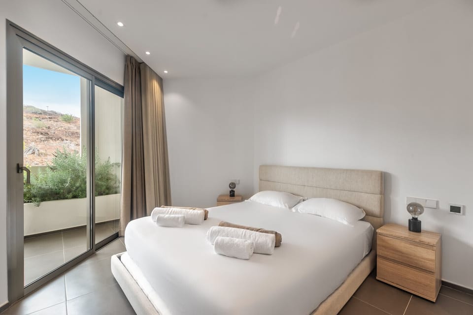 Spacious bedroom with terrace and king-size bed