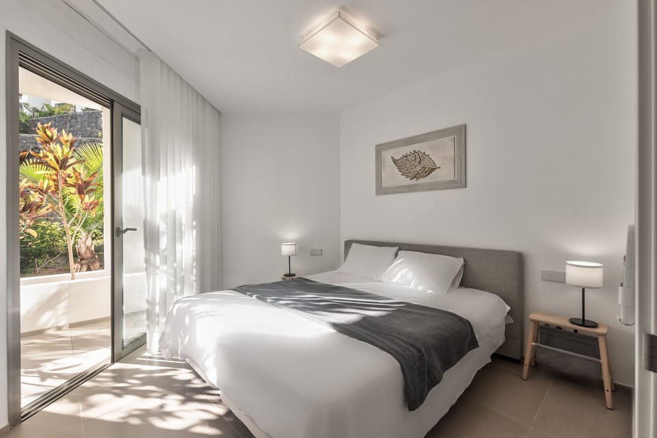 Spacious bedroom with terrace and king-size bed