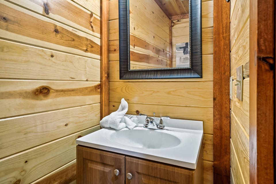 This 1/2 bath is connected to the kitchen for easy access.