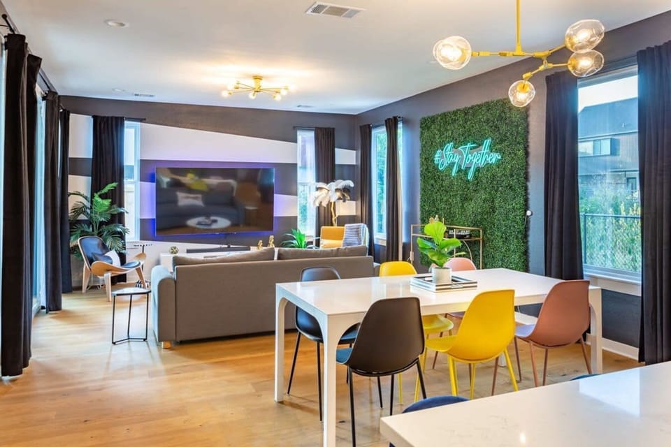 Bright Living Area With A Large Smart TV And Modern Dining Space