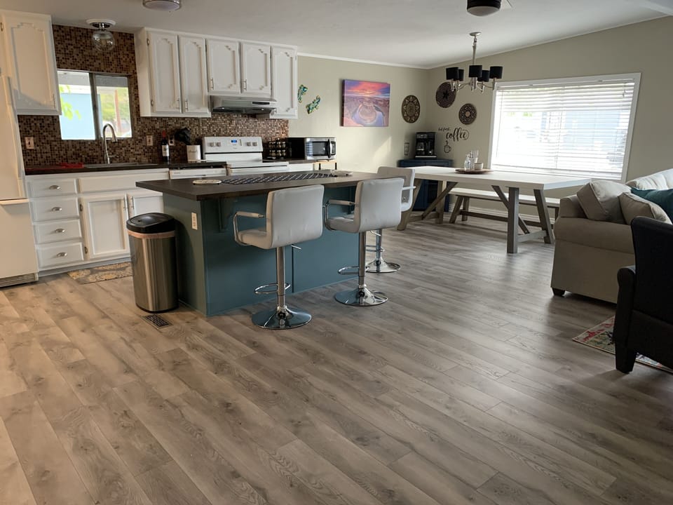 Plenty of gathering space in the open kitchen/dining/living room area.