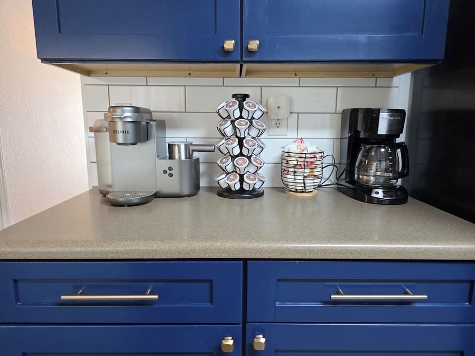 K-Cups, Coffee Creamer, and Drip coffee maker provided.