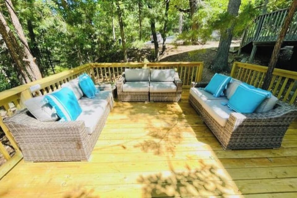 A relaxing outdoor seating area surrounded by nature.