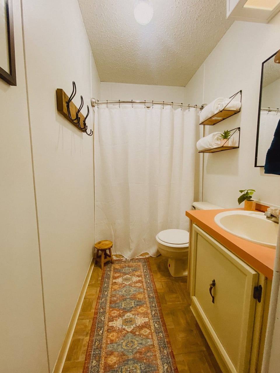 Guest bathroom complete with tub/shower combo.