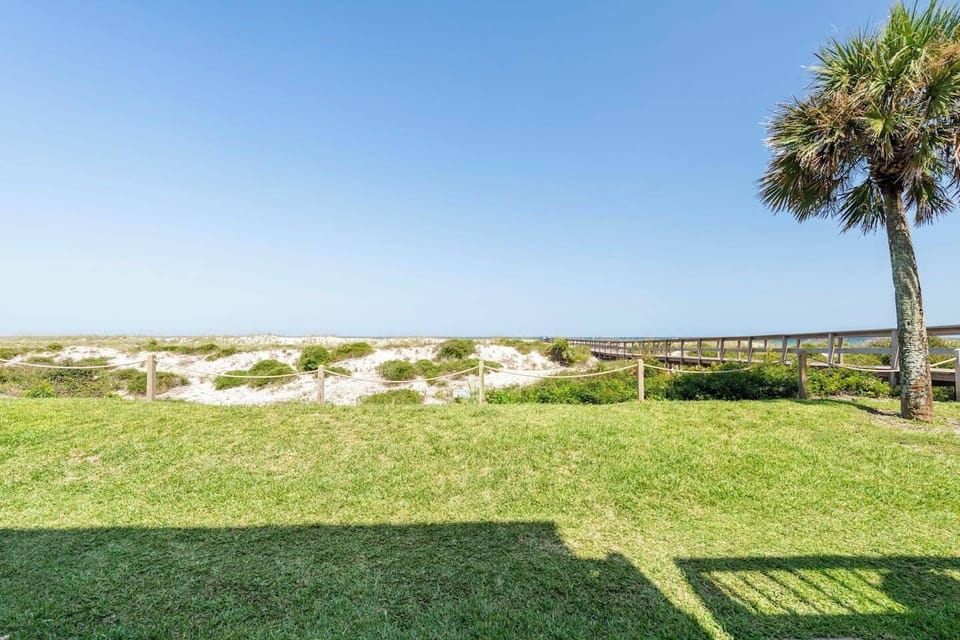 Embrace the sea breeze and unwind on your own private patio. Walk straight out to the sandy shores!