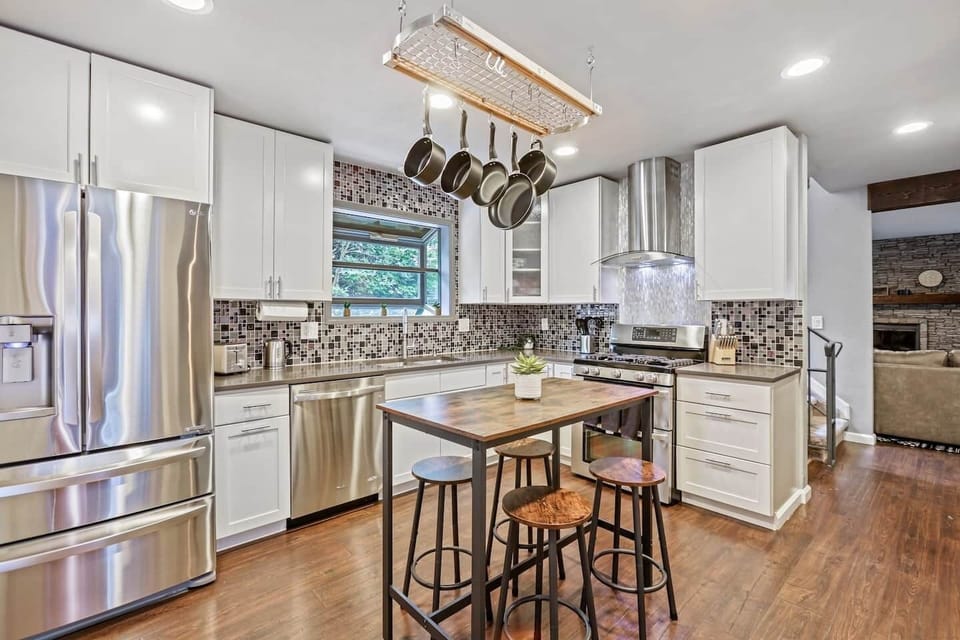 Elevate your dining experiences in our expansive kitchen with upgraded appliances, modern interiors and stocked with essentials for a convenient cooking experience.