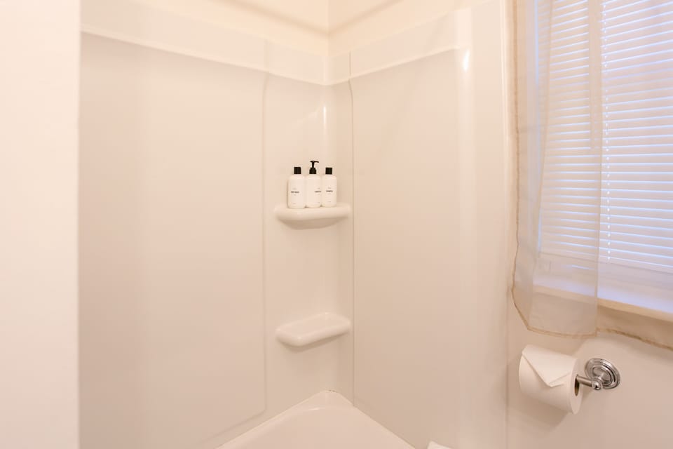 Minimalistic and clean shower area with quality toiletries.