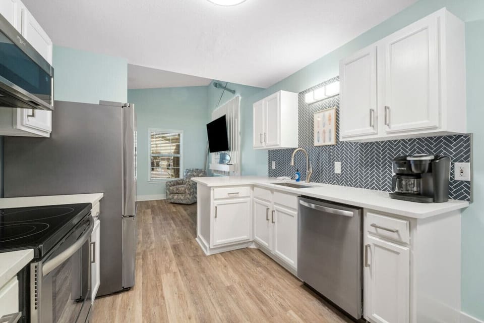 Full Size Kitchen and Dining Areas with Bar Seating