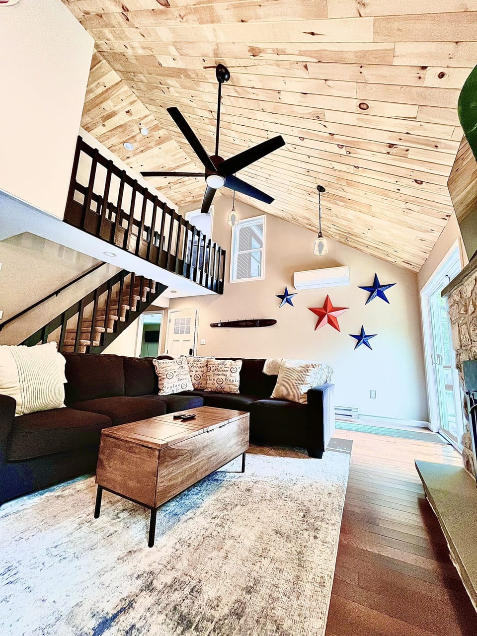 High ceilings, gas fireplace w 55" smart tv and lots of natural light 