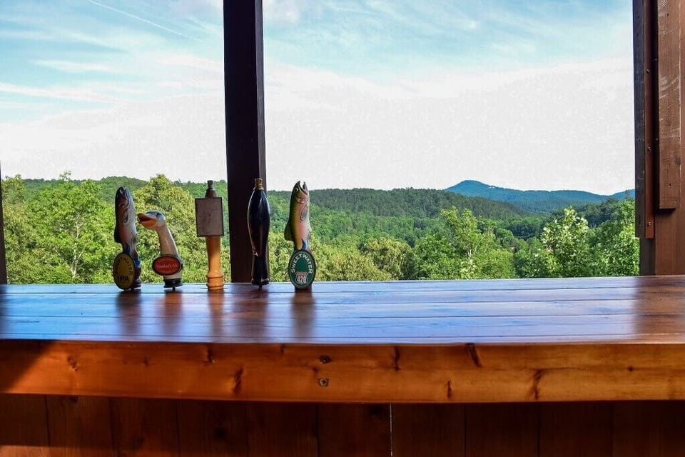 Downstairs Porch with outdoor TV and outdoor entertaining area with bar.