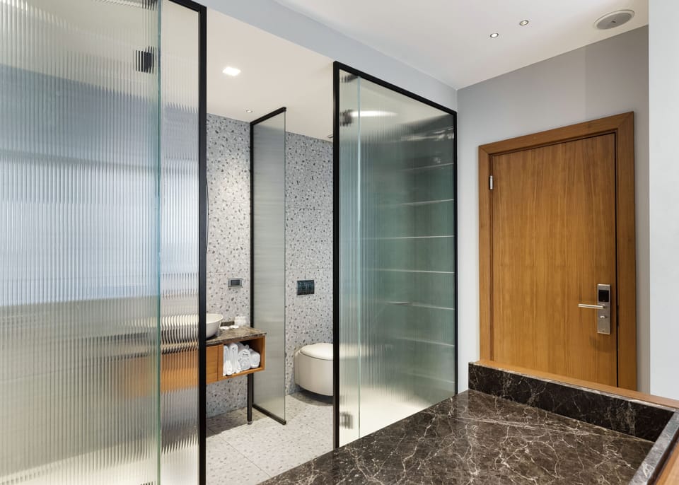 Triple Deluxe With Balcony | Bathroom | Shower, rainfall showerhead, slippers, bidet