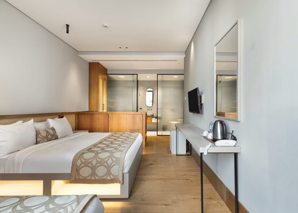 Triple Deluxe With Balcony | In-room safe, desk, laptop workspace, blackout drapes