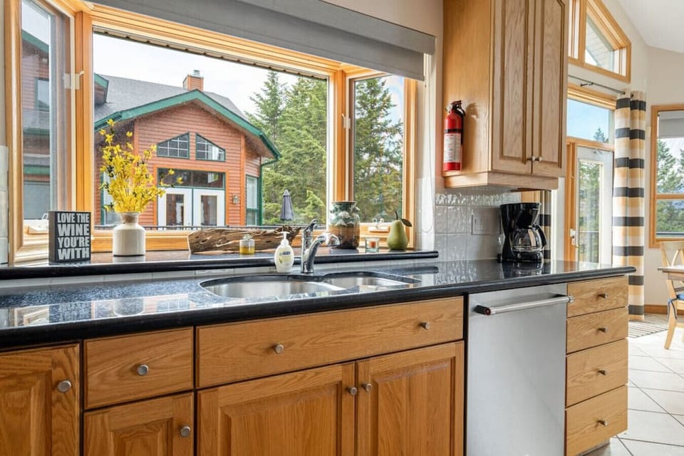 Full kitchen with a crockpot, kettle, drip coffee machine, ground coffee, tea, sugar and basic condiments (ketchup, mustard and relish.)