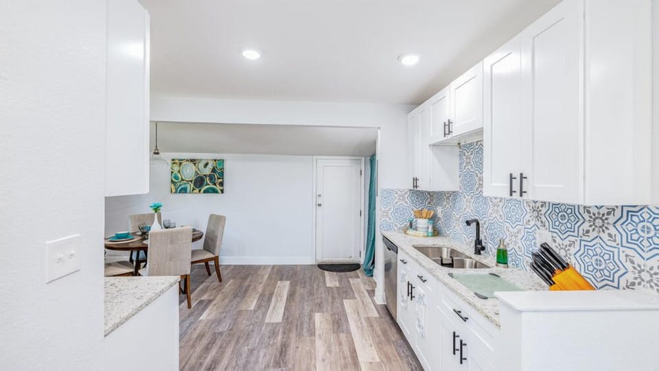 This kitchen has functional cabinets that provide ample storage space.