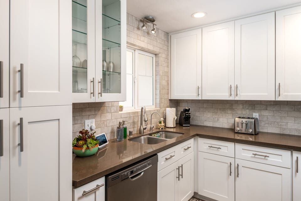 The kitchen is outfitted with high end appliances and equipment