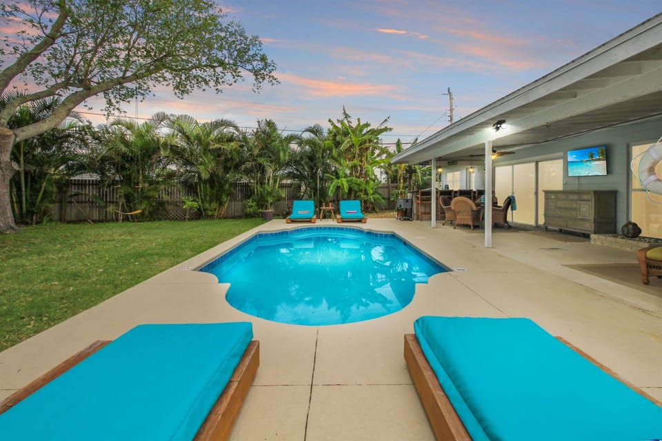 Lounge beside a heated pool and enjoy the outdoor living/dining/bar areas with smart TV