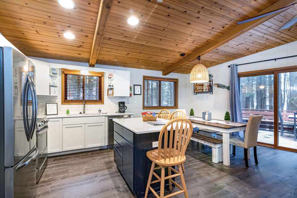 Kitchen area and dining room table.