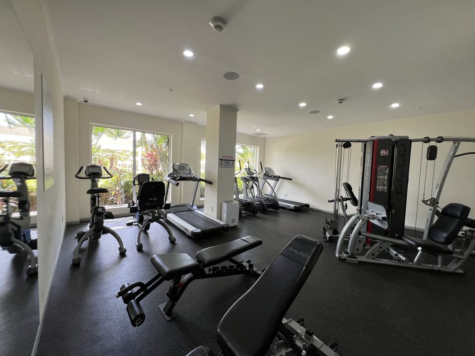 Le Vent Gym on the main floor with views to the luscious green gardens.