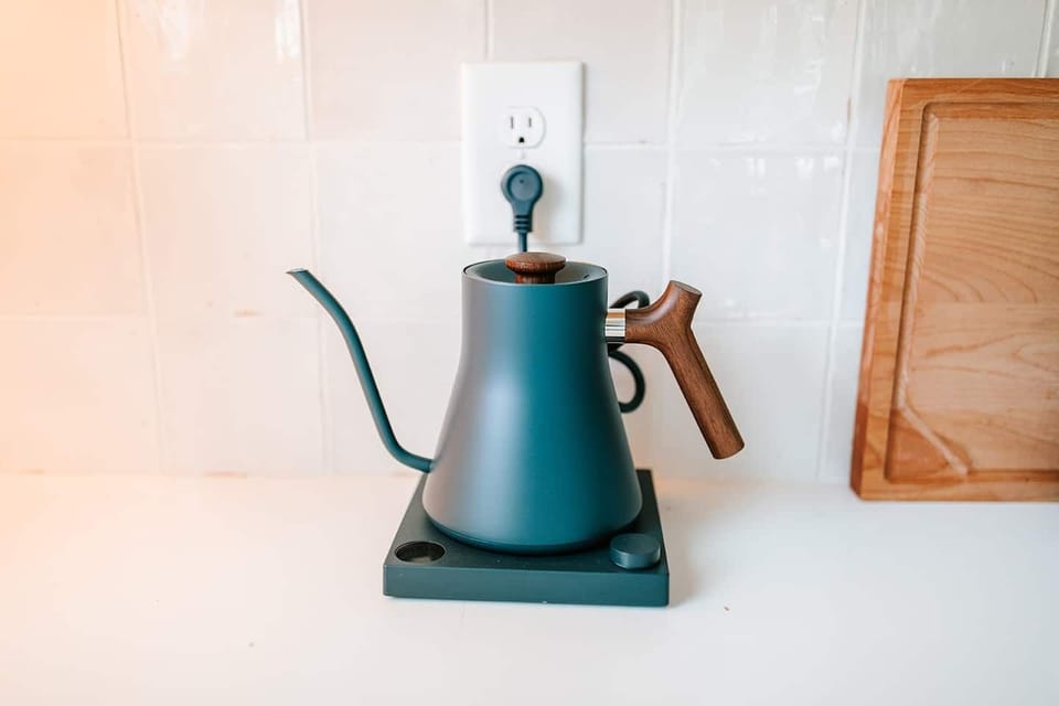 Elevate your coffee game: this kitchen is equipped with a Fellow Stagg Kettle, perfect for coffee lovers looking to brew the perfect cup with precision and style.