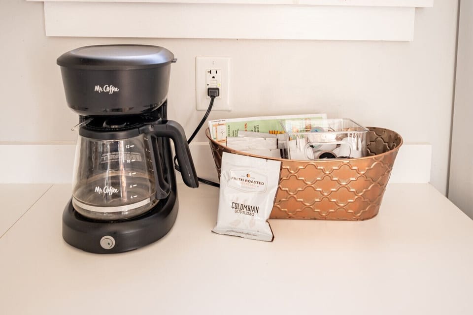 Fully equipped with a microwave, oven, range, and breakfast nook—complete with a Keurig and coffee essentials. Adjacent to the dining area.