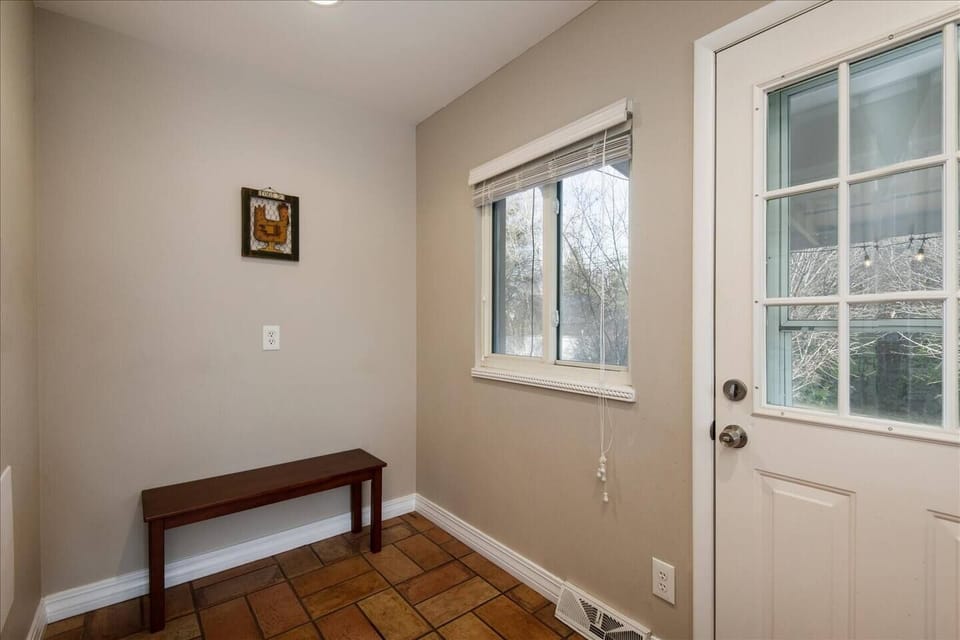 The kitchen naturally flows to a mud room and the covered patio space.