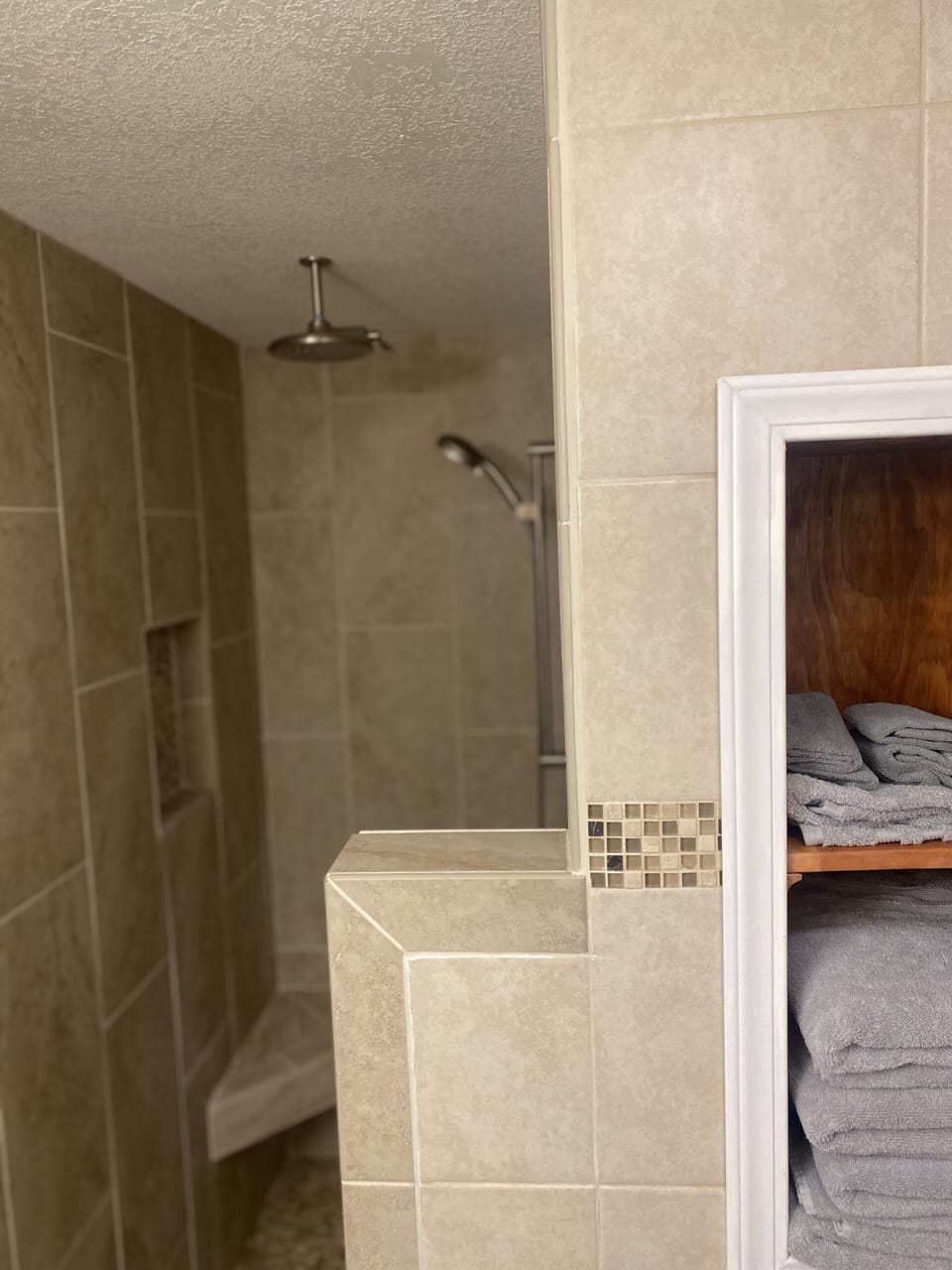 Upstairs bathroom with walk-in shower and dual showerheads.