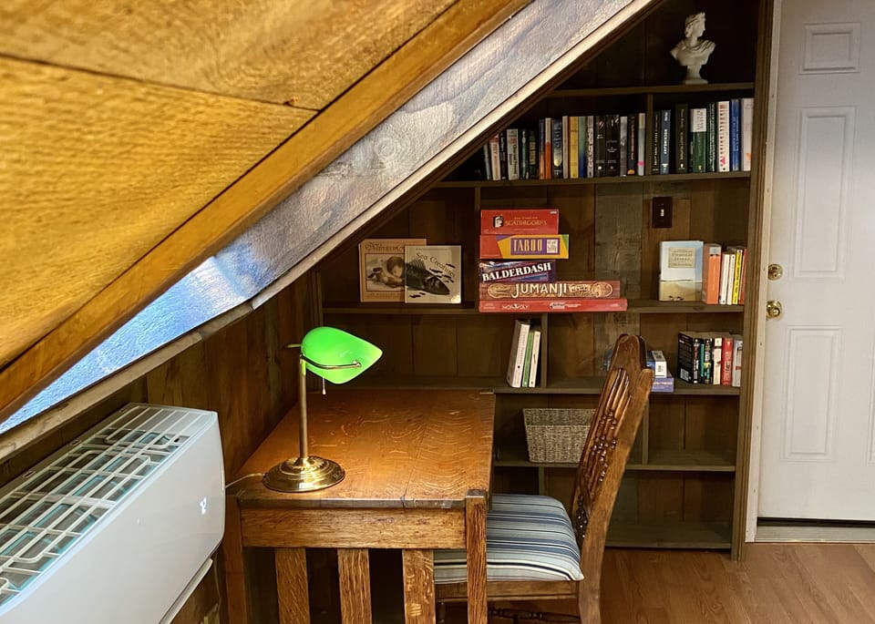 Desk with bookcase, games and great reads!