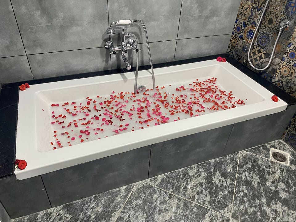 Lagoon view room | Bathroom | Shower, hair dryer (on request), towels