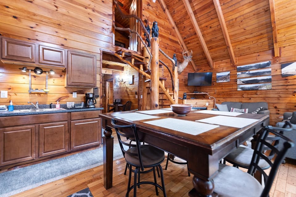 Rustic kitchen and dining area with cozy log cabin charm
